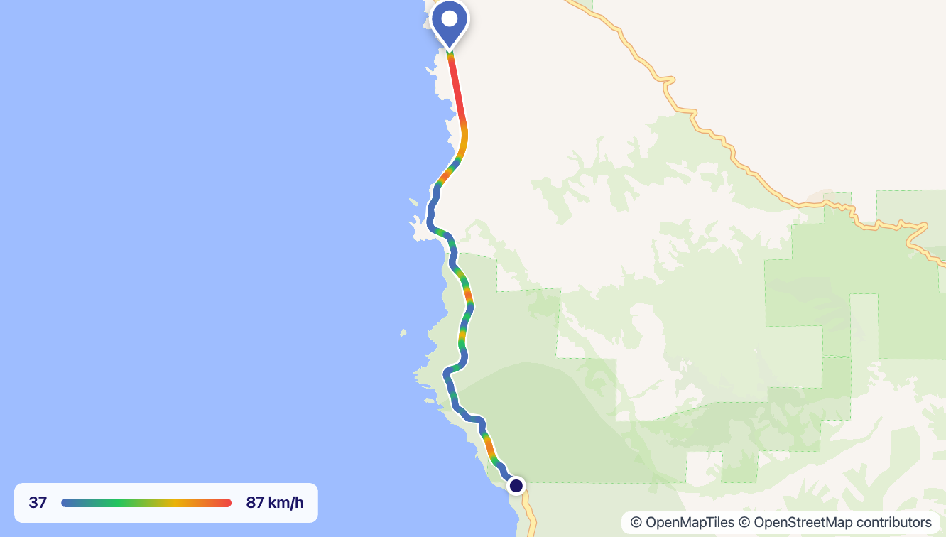 A dash cam route along the coast, coloured from blue on the slow bends to red on the fast stretches, with a speed scale from 37 to 87 km/h